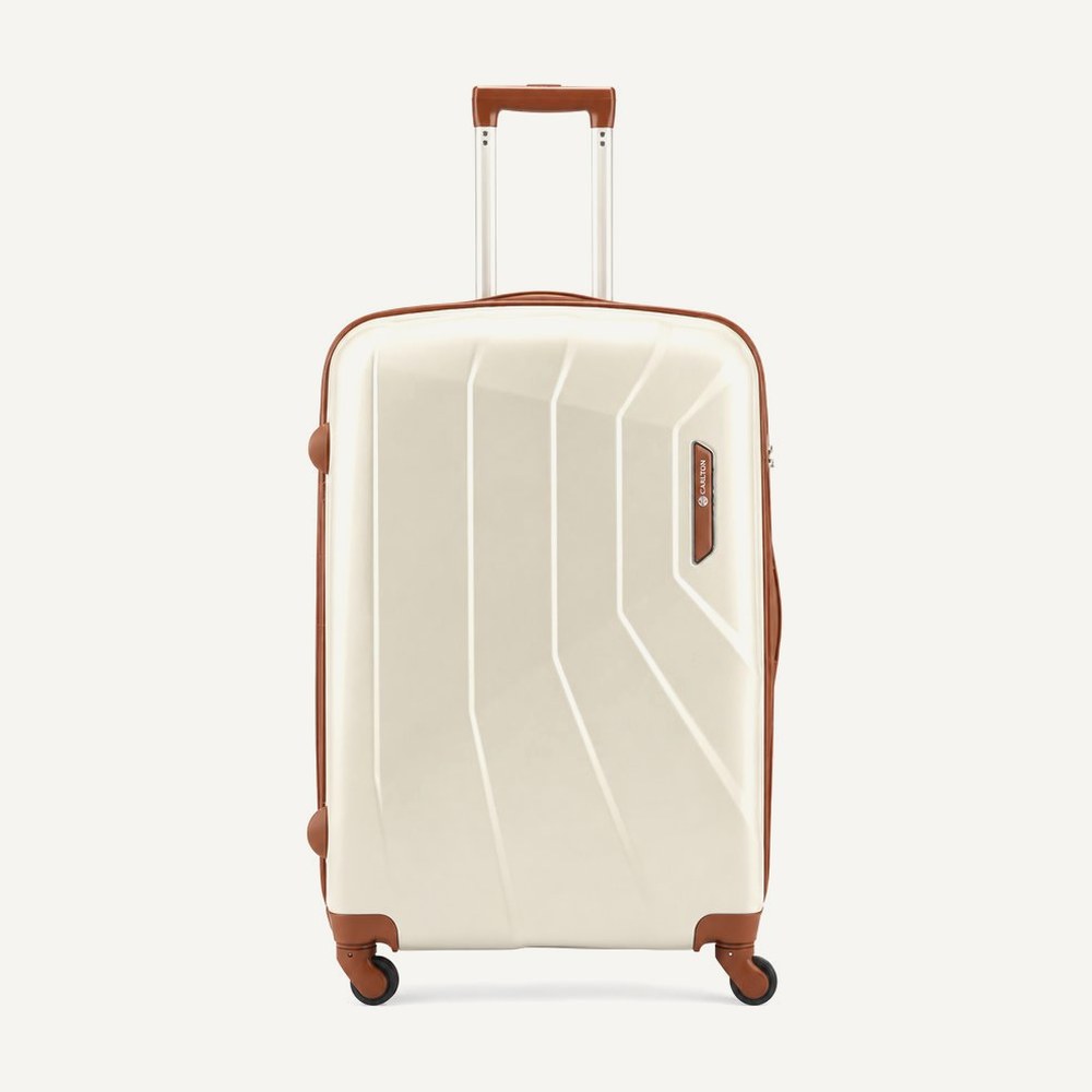 Carlton faceted hard shell suitcase in cream with tan trim and handles, four wheels