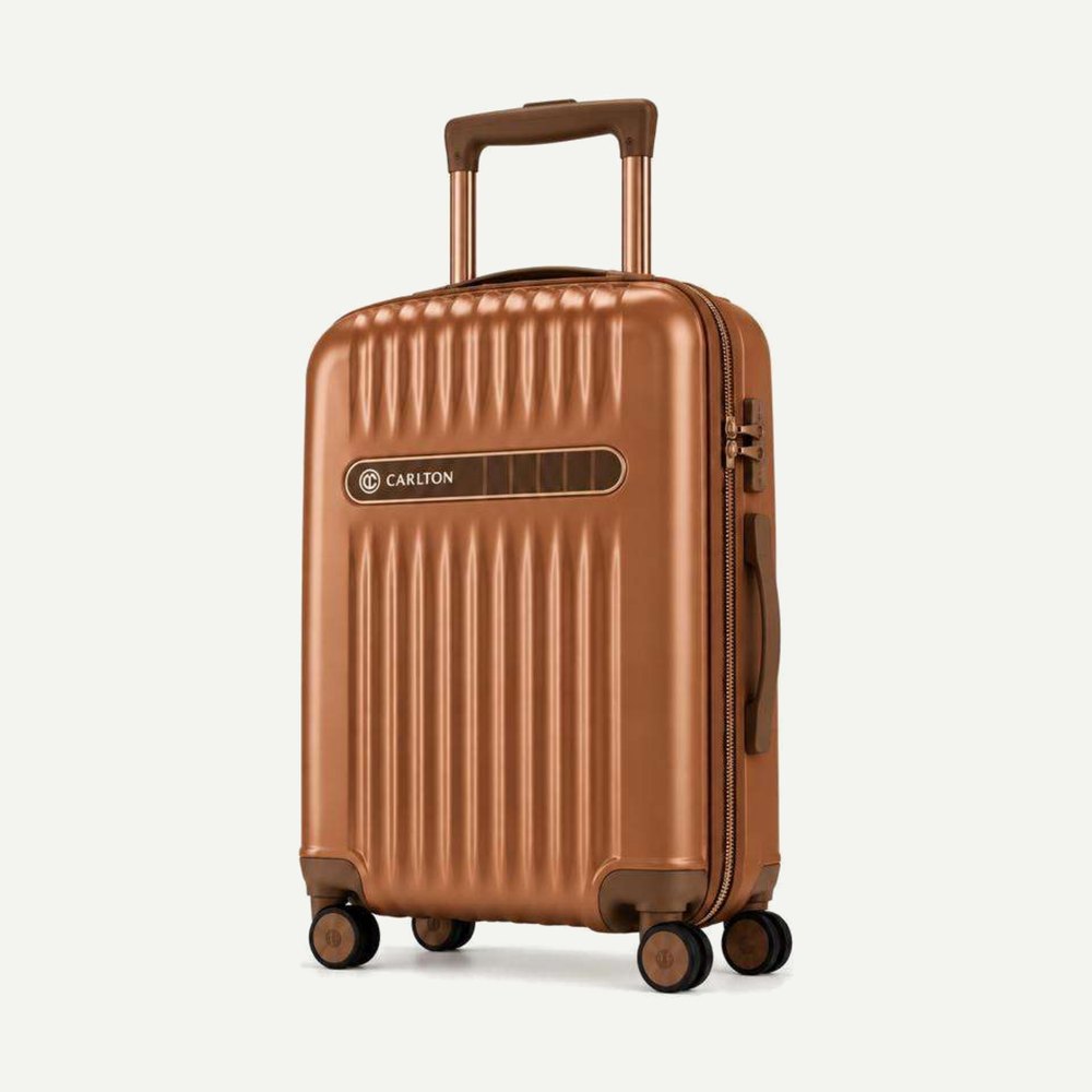 Carlton ribbed hard shell cabin suitcase in copper brown with bronze hardware, four wheels