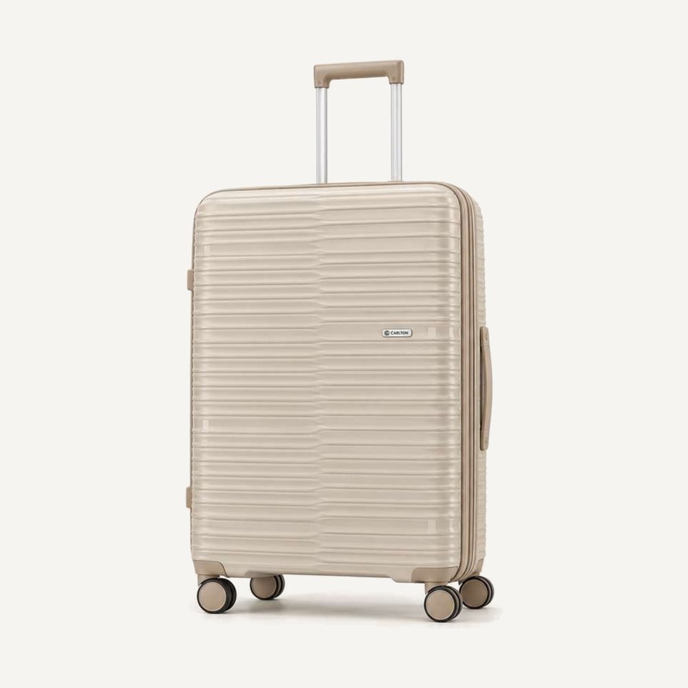 Carlton fine-ribbed hard shell suitcase in warm beige with colour-matched handles, four wheels