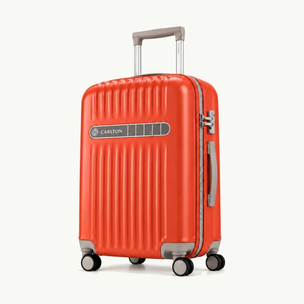 Carlton ribbed hard shell cabin suitcase in bright orange-red with light grey trim and silver hardware, four wheels