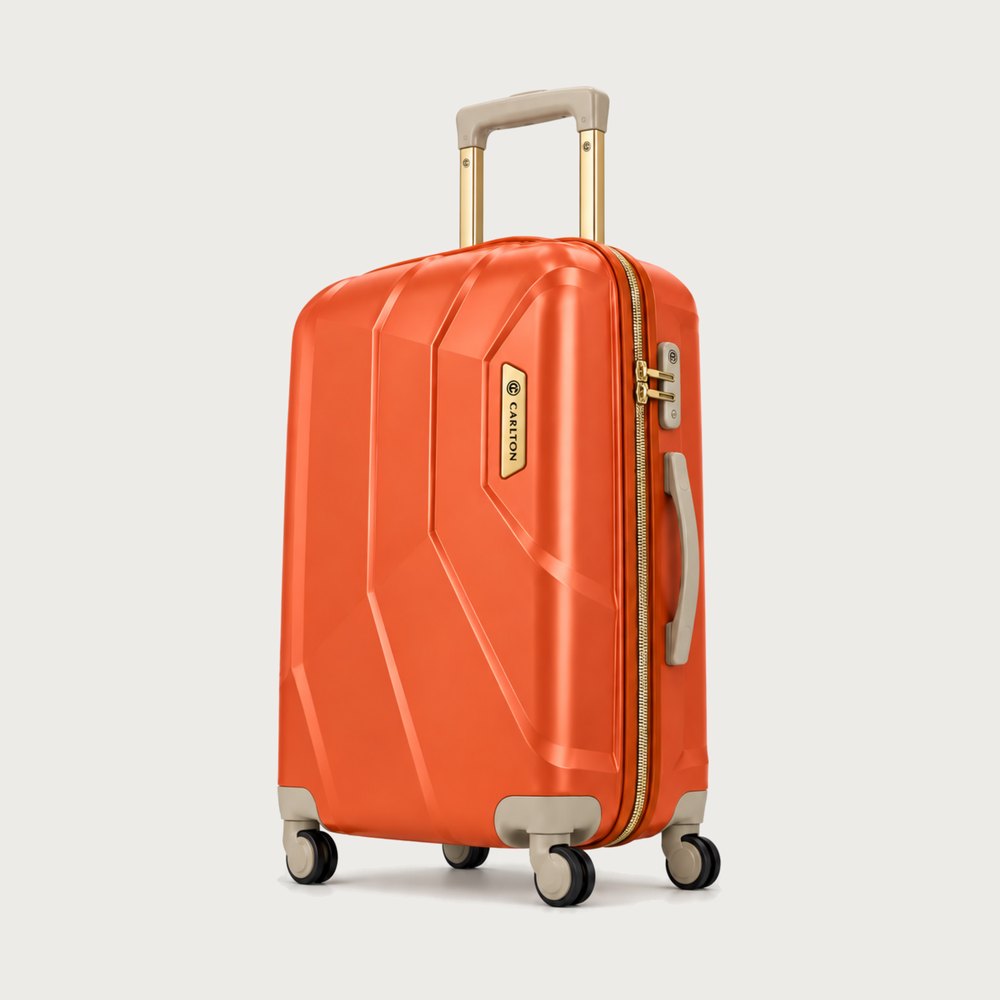 Carlton faceted hard shell suitcase in orange with beige trim and gold hardware, four wheels