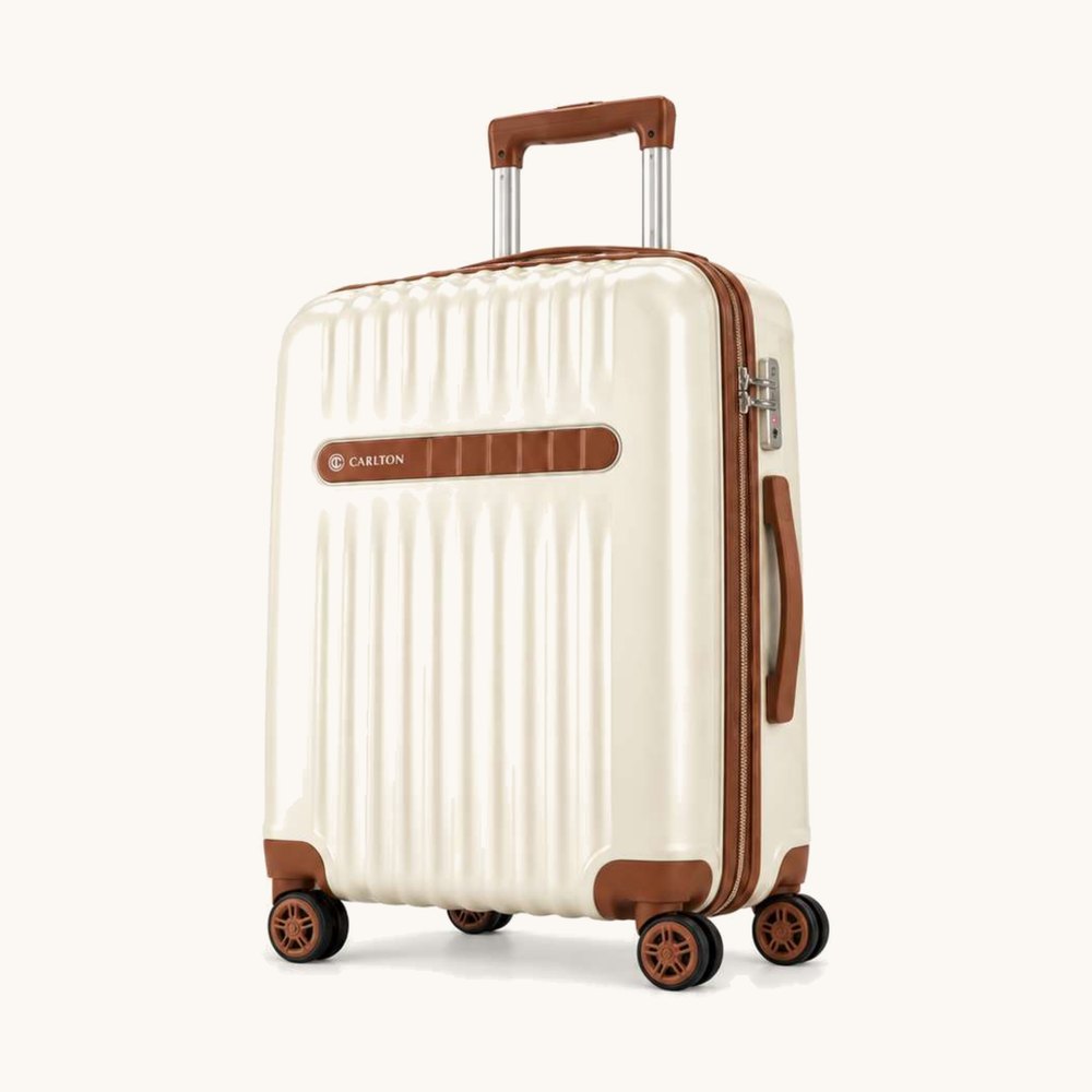 Carlton ribbed hard shell cabin suitcase in warm ivory with saddle brown trim and handles, four wheels