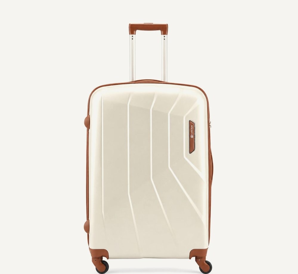 Carlton cream hard shell suitcase with tan trim and handles, four wheels